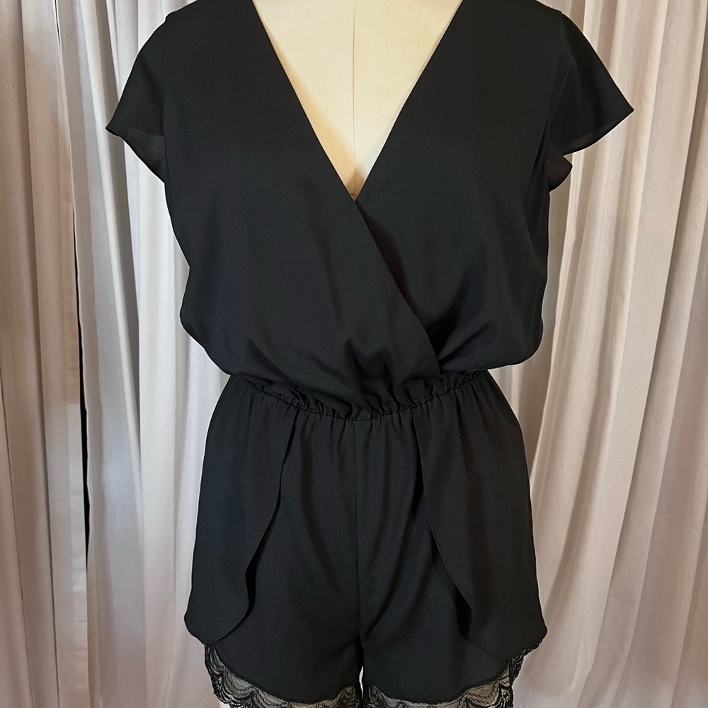 Bebe black short romper with lace trim
Sz S